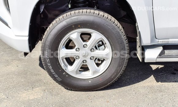 Buy Import Mitsubishi L200 White Car in Import - Dubai in Barbados Buy Import Mitsubishi L200 White Car in Import - Dubai in Barbados