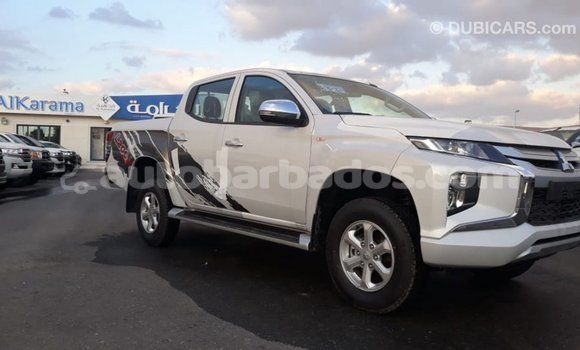 Buy Import Mitsubishi L200 White Car in Import - Dubai in Barbados Buy Import Mitsubishi L200 White Car in Import - Dubai in Barbados