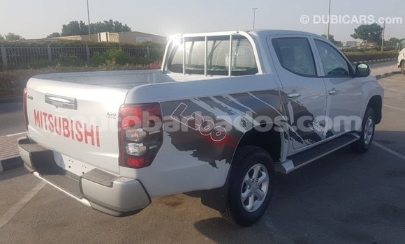 Buy Import Mitsubishi L200 White Car in Import - Dubai in Barbados Buy Import Mitsubishi L200 White Car in Import - Dubai in Barbados
