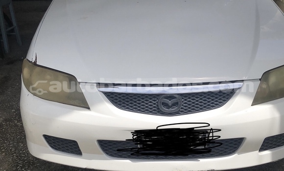 Buy Used Mazda Familia White Car in Bridgetown in Barbados Buy Used Mazda Familia White Car in Bridgetown in Barbados