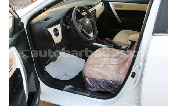 Buy Import Toyota Corolla White Car in Import - Dubai in Barbados Buy Import Toyota Corolla White Car in Import - Dubai in Barbados